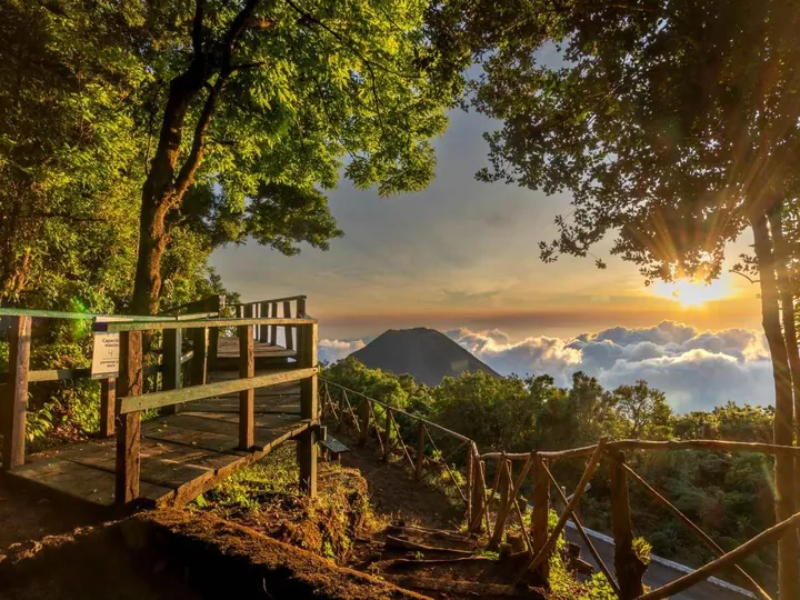 Wooden viewpoint at Cerro Verde with the Izalco volcano above the clouds